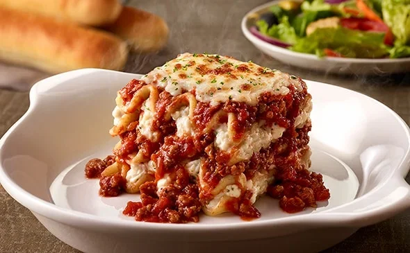 Get the Lunch-sized Lasagna Classico served with salad and breadsticks. - Olive Garden Menu 2025