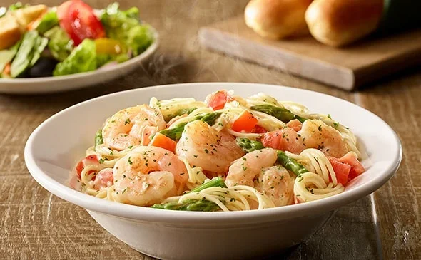 Get the Lunch-sized Shrimp Scampi served with salad and breadsticks. - Olive Garden Menu 2025