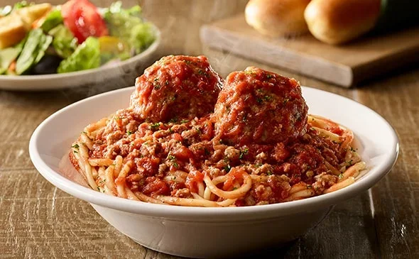 Get the Lunch-sized Spaghetti with Meatballs served with salad and breadsticks. - Olive Garden Menu 2025