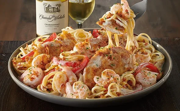 Enjoy the Chicken & Shrimp Carbonara in a creamy sauce with bacon and roasted red peppers. - Olive Garden Pasta Menu