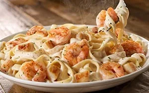Try our delicious Seafood Alfredo with homemade alfredo sauce and sautéed shrimp. - Olive Garden Pasta Menu